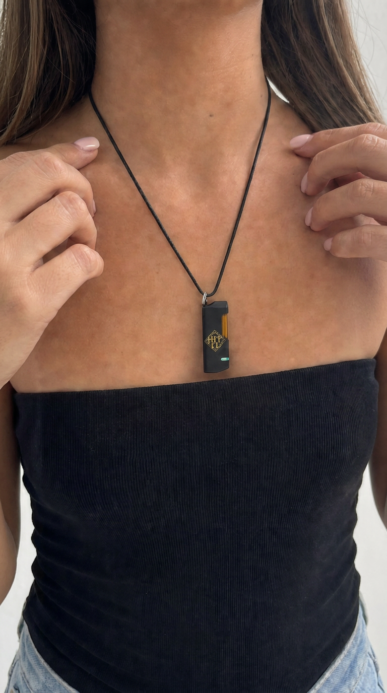 HIT IT pendant worn with black tube top